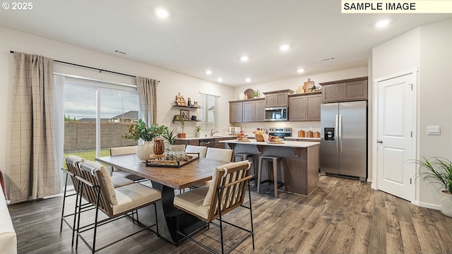 dining space featuring visible vents, recessed lighting, and dark wood-style flooring