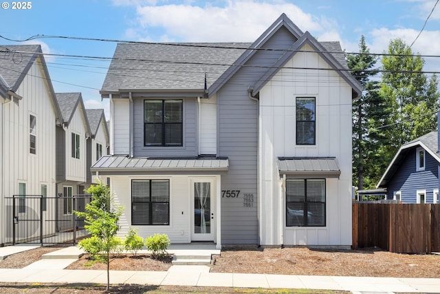 7557 N Gilbert Ave, Portland, OR 97203 - modern farmhouse style home with a shingled roof, a standing seam roof, a metal roof, and board and batten siding