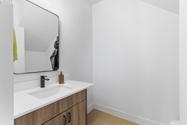 7557 N Gilbert Ave, Portland, OR 97203 - bathroom featuring vanity and wood finished floors