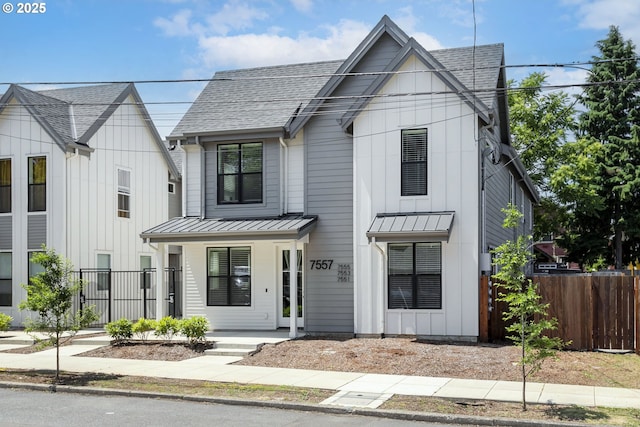 7557 N Gilbert Ave, Portland, OR 97203 - modern farmhouse with a standing seam roof, a shingled roof, board and batten siding, and covered porch