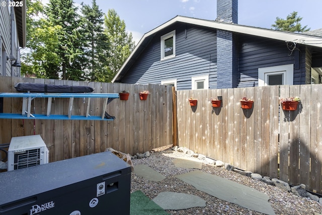 7557 N Gilbert Ave, Portland, OR 97203 - view of side of home with a chimney