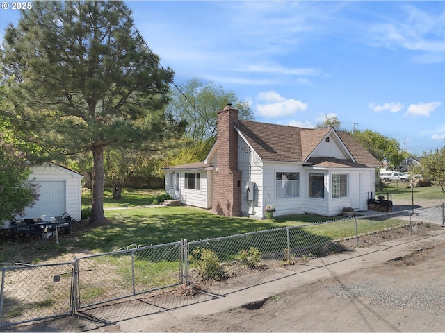 view of side of home featuring a gate, a chimney, a shingled roof, an outbuilding, and a storage unit