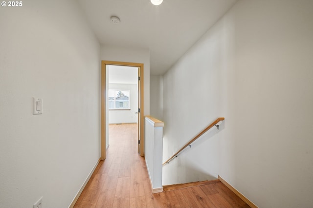 corridor with light wood-type flooring