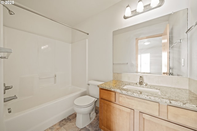 full bathroom with washtub / shower combination, vanity, and toilet