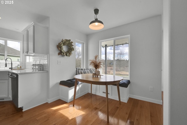 dining area featuring plenty of natural light, light wood-type flooring, and breakfast area