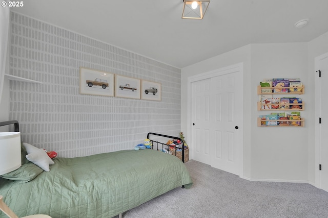 bedroom with carpet flooring and a closet