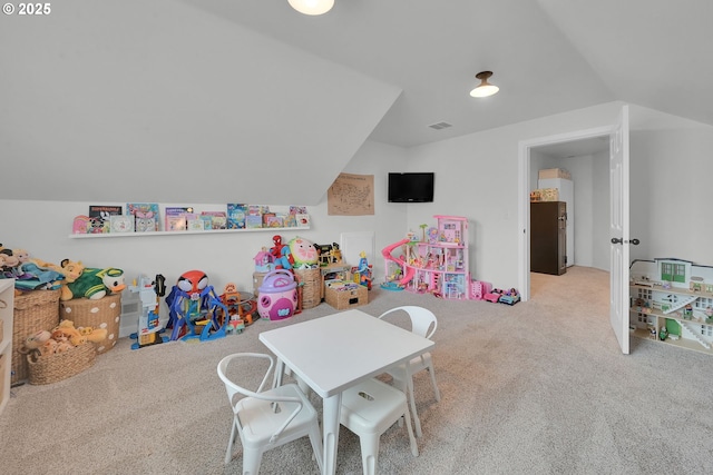 game room featuring lofted ceiling and light colored carpet