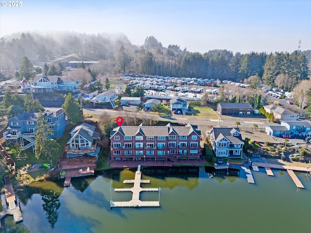 birds eye view of property featuring a water view and a residential view