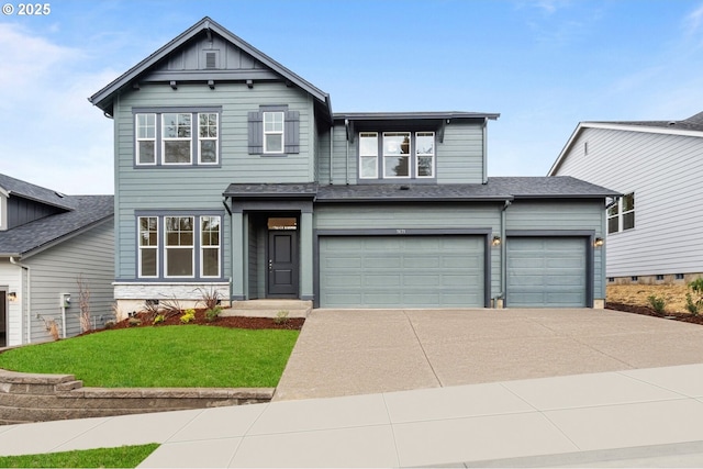 view of front of home with a garage and a front lawn