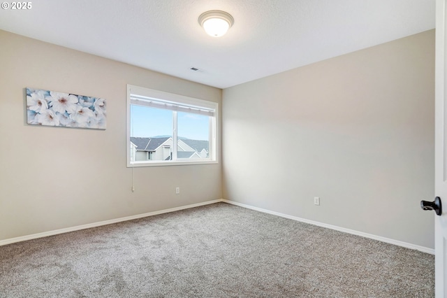 empty room featuring carpet flooring