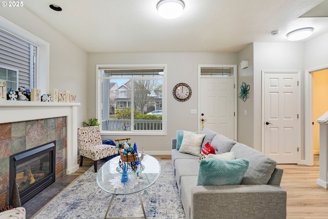 living room with hardwood / wood-style floors and a fireplace