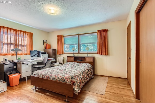 14385 SW Hargis Rd, Beaverton, OR 97008 - bedroom featuring a textured ceiling and wood finished floors