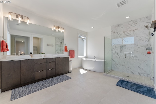 15875 NW Ridgeline St, Portland, OR 97229 - bathroom featuring a marble finish shower, a soaking tub, double vanity, and recessed lighting