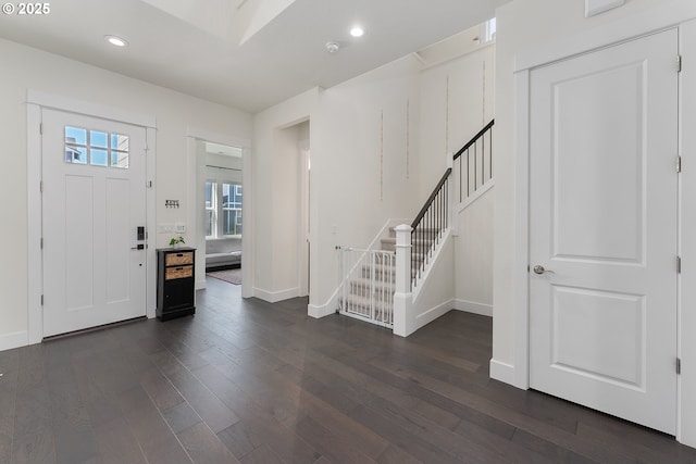 15875 NW Ridgeline St, Portland, OR 97229 - foyer entrance featuring stairway, dark wood-style floors, and recessed lighting