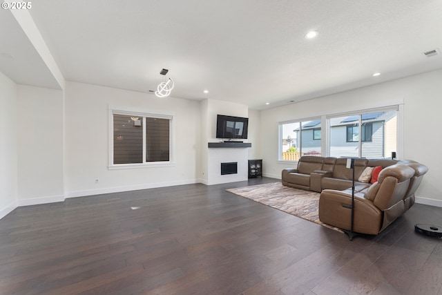 15875 NW Ridgeline St, Portland, OR 97229 - living room with dark wood-type flooring, recessed lighting, and a fireplace