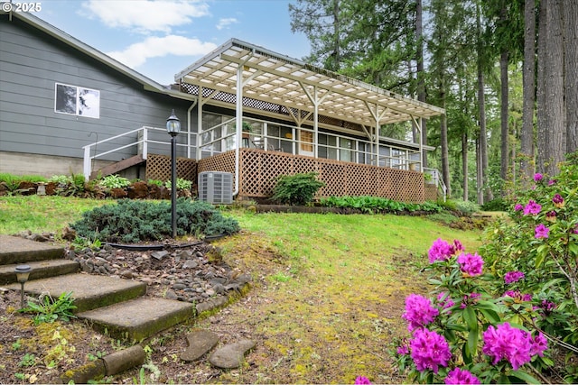 82091 Lost Valley Ln, Dexter, OR 97431 - rear view of property with a pergola, cooling unit, stairs, and a lawn