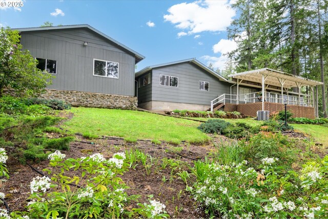82091 Lost Valley Ln, Dexter, OR 97431 - back of property with stairway, a yard, and central air condition unit