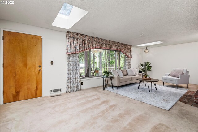 82091 Lost Valley Ln, Dexter, OR 97431 - carpeted living area featuring a skylight and a textured ceiling