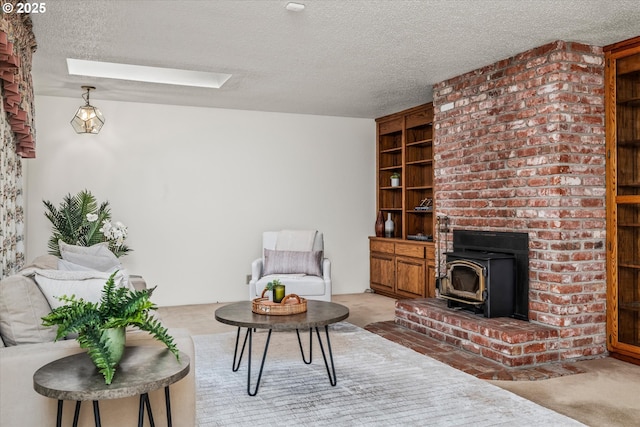 82091 Lost Valley Ln, Dexter, OR 97431 - carpeted living area featuring a textured ceiling, a wood stove, and a skylight