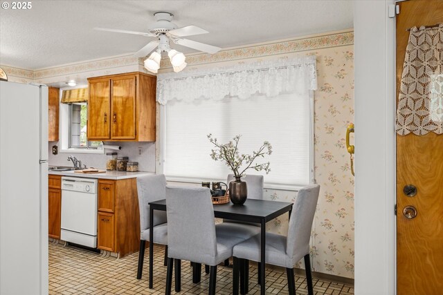 82091 Lost Valley Ln, Dexter, OR 97431 - dining room featuring a ceiling fan, wallpapered walls, a textured ceiling, and brick patterned flooring