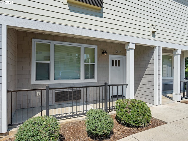 doorway to property with a porch