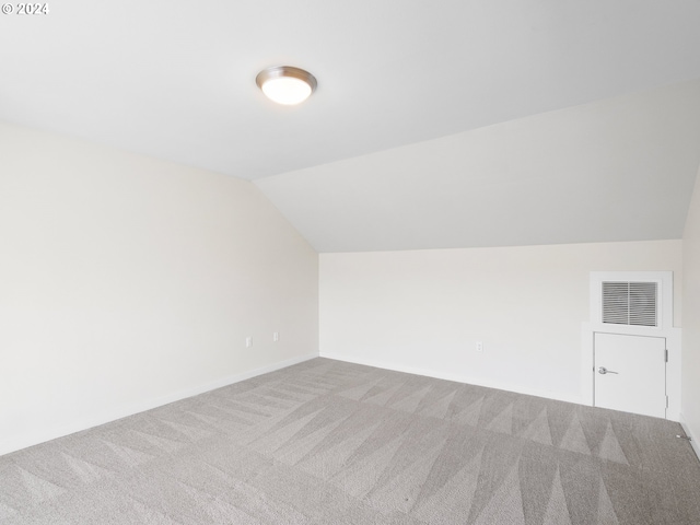 bonus room featuring carpet and lofted ceiling