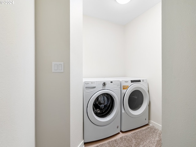 washroom with separate washer and dryer