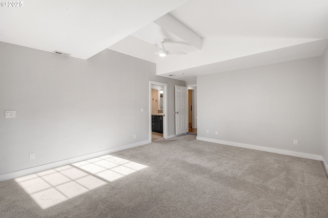 unfurnished bedroom featuring vaulted ceiling with beams, light carpet, visible vents, baseboards, and ensuite bath