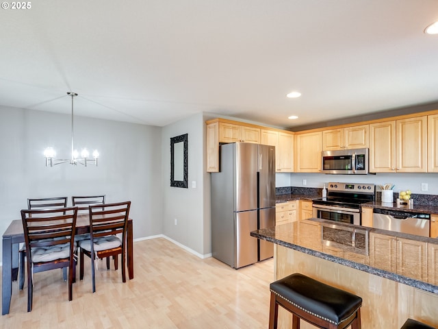 1091 56th St, Washougal, WA 98671 - kitchen featuring stainless steel appliances, light brown cabinetry, recessed lighting, a chandelier, and light wood finished floors