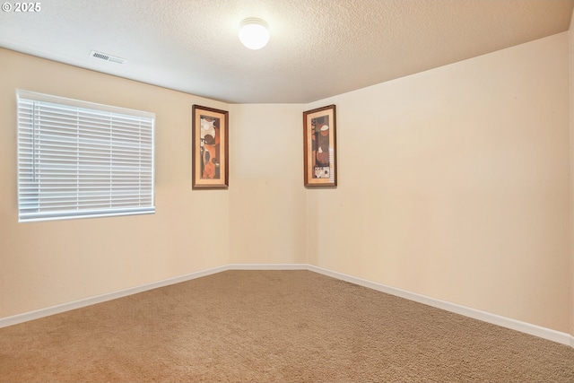 503 NW Hertel St, Hillsboro, OR 97124 - empty room with carpet, baseboards, and a textured ceiling