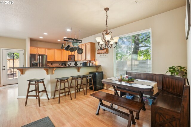 503 NW Hertel St, Hillsboro, OR 97124 - dining space featuring healthy amount of natural light, a chandelier, light wood-type flooring, and recessed lighting