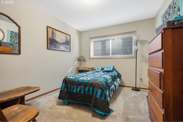 bedroom featuring carpet floors and baseboards