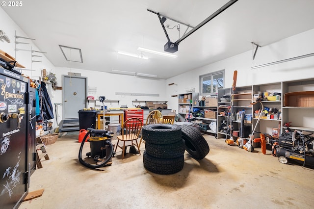 garage featuring a workshop area and a garage door opener
