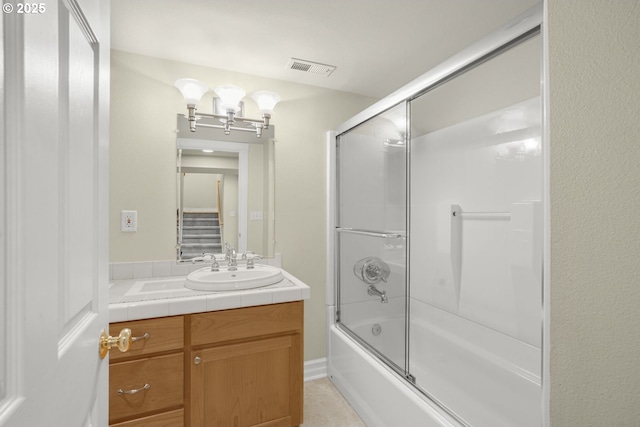 7307 SW Capitol Hwy, Portland, OR 97219 - bathroom featuring vanity and shower / bath combination with glass door