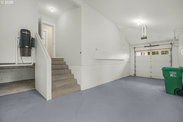 7307 SW Capitol Hwy, Portland, OR 97219 - garage with a central vacuum unit and a garage door opener