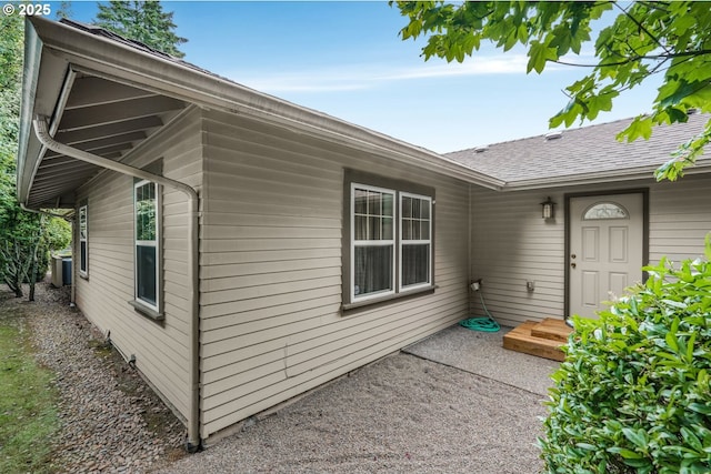 7307 SW Capitol Hwy, Portland, OR 97219 - doorway to property featuring roof with shingles