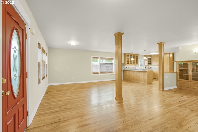 7307 SW Capitol Hwy, Portland, OR 97219 - foyer entrance featuring ornate columns and light wood finished floors