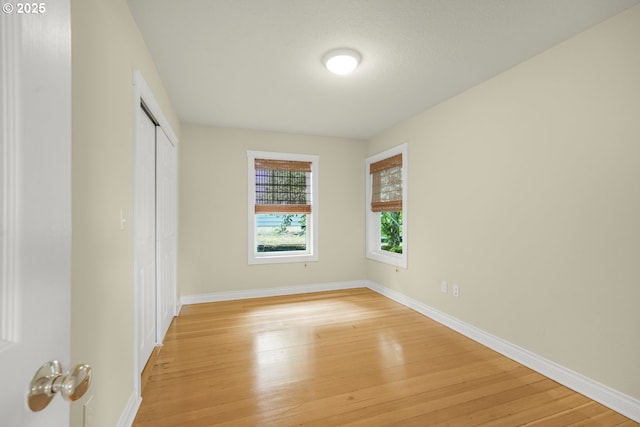 7307 SW Capitol Hwy, Portland, OR 97219 - unfurnished bedroom featuring light wood finished floors and a closet
