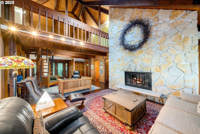 living room with high vaulted ceiling, a fireplace, hardwood / wood-style flooring, wooden ceiling, and beam ceiling