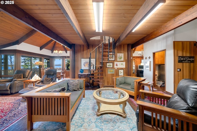 living room with hardwood / wood-style floors, wood walls, vaulted ceiling with beams, a chandelier, and wood ceiling