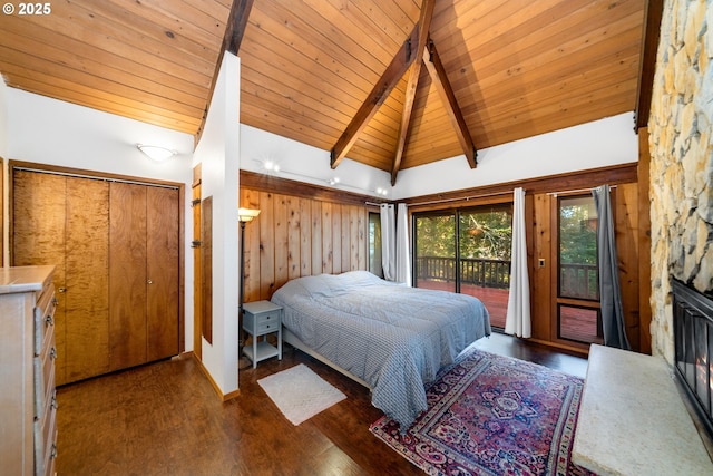 bedroom with dark wood-type flooring, wood ceiling, high vaulted ceiling, access to outside, and beam ceiling