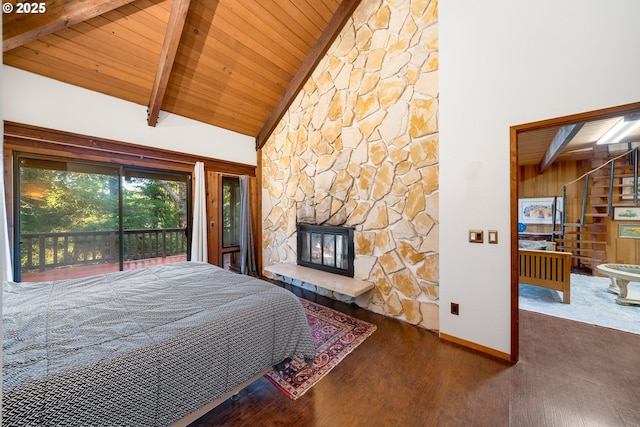 bedroom featuring a stone fireplace, high vaulted ceiling, beamed ceiling, wood-type flooring, and wood ceiling