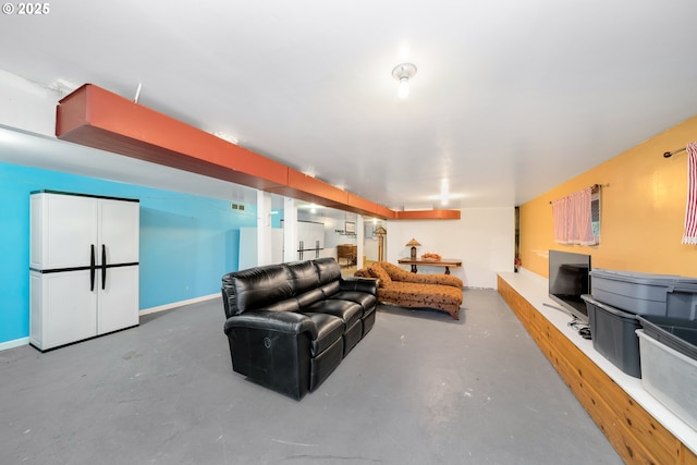 living room featuring concrete flooring