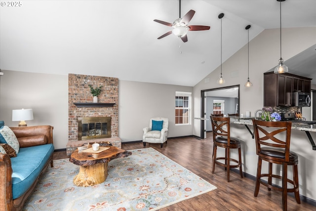 870 Sheraton Dr, Eugene, OR 97401 - living room featuring ceiling fan, high vaulted ceiling, dark wood-style floors, and a brick fireplace