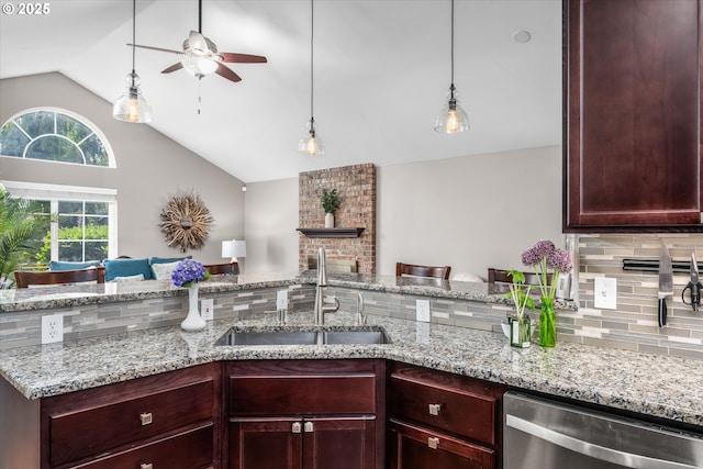 870 Sheraton Dr, Eugene, OR 97401 - kitchen with stainless steel dishwasher, lofted ceiling, a ceiling fan, decorative backsplash, and open floor plan