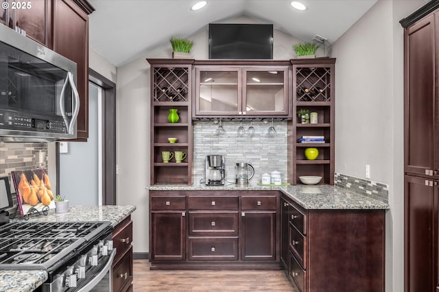 870 Sheraton Dr, Eugene, OR 97401 - kitchen featuring stainless steel appliances, open shelves, decorative backsplash, light wood-style flooring, and lofted ceiling