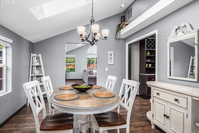 870 Sheraton Dr, Eugene, OR 97401 - dining area featuring dark wood-type flooring, vaulted ceiling, a chandelier, and a skylight