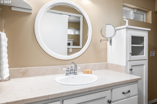 870 Sheraton Dr, Eugene, OR 97401 - bathroom featuring vanity and a textured wall