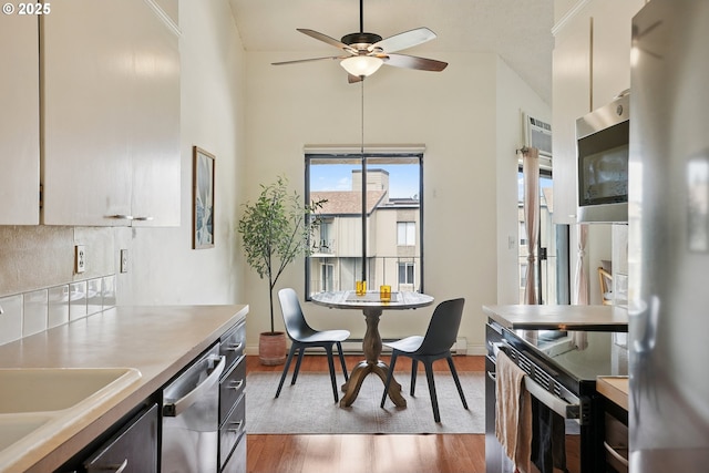 5585 E Evergreen Blvd, Vancouver, WA 98661 - dining area with ceiling fan, wood finished floors, and a towering ceiling