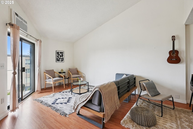 5585 E Evergreen Blvd, Vancouver, WA 98661 - sitting room with vaulted ceiling, wood finished floors, and a textured ceiling